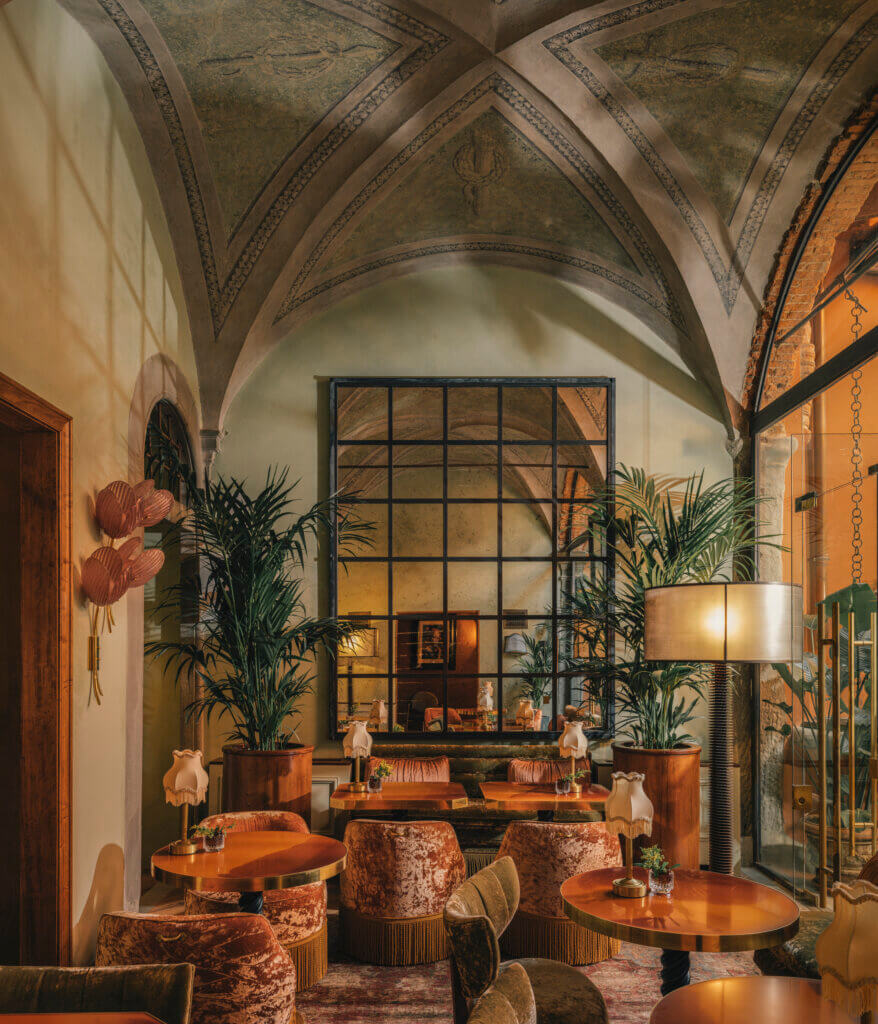 Elegant interior of The James restaurant in Florence with Renaissance vaulted ceilings, warm lighting, and refined design details.