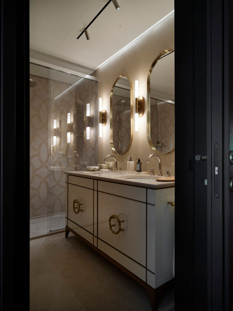 Custom Luxury Bathroom with Sculptural Details — Saint-Tropez Villa Custom-designed luxury bathroom in the Saint-Tropez villa by Primadesign, featuring bespoke brass handles, sculptural mirrors, integrated lighting, and refined ceramic textures.