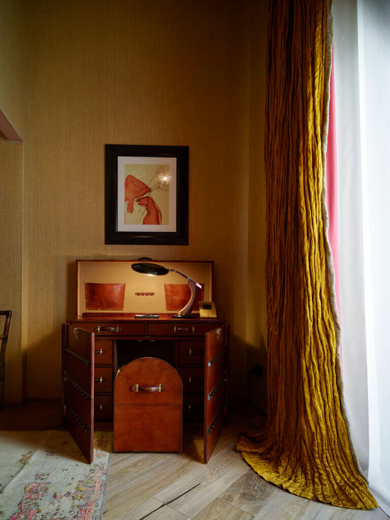 Rare handcrafted wooden cabinet and digital artwork at The James Hotel, Florence, blending materiality, art, and design.